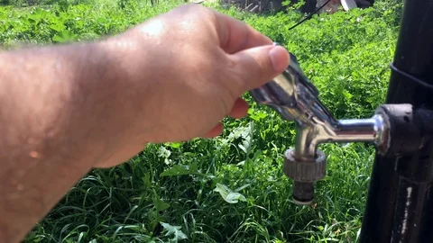 Opening and closing the tap Stock Footage 127106716