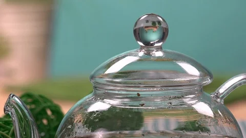 Opening and closing of the teapot. Closeup Stock Footage