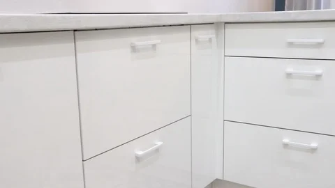 Opening and closing the white kitchen drawer. Video stock 116054496