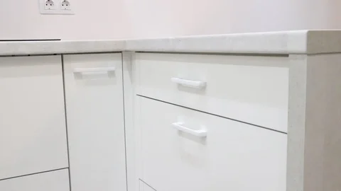 Opening and closing the white kitchen drawer. Stock Footage 116054722