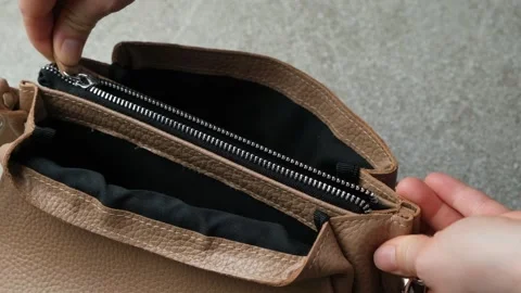 Opening and closing the zipper on the inside pocket of the womens leather Stock Footage 311726910