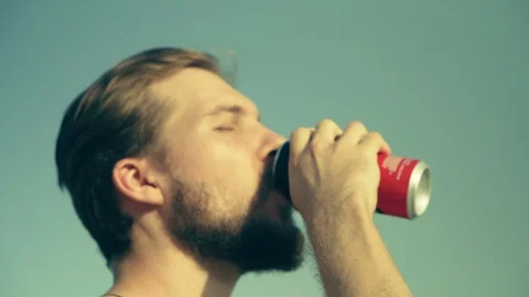 Opening and Drinking from a Can of Beverage Stock Footage 129469066