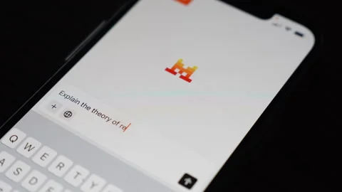 Opening and typing a question in the Le Chat AI app on a mobile phone screen. Stock Footage 304170256