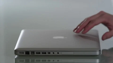 Opening an Apple Mac Book Pro Stock Footage 72211781