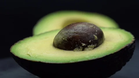 OPENING AN AVOCADO AT 100 FPS Stock Footage