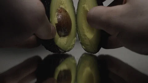Opening a Avocado focus pull, Avocado, White, Fresh, Ripe, Health, Exotic, Stock Footage 87796941
