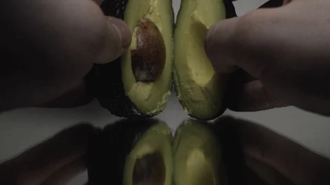 Opening a Avocado focus pull, Avocado, White, Fresh, Ripe, Health, Exotic, Stock Footage 87796951