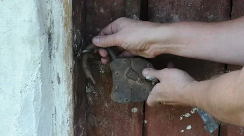 Opening barn lock with keys Stock Footage 42422489