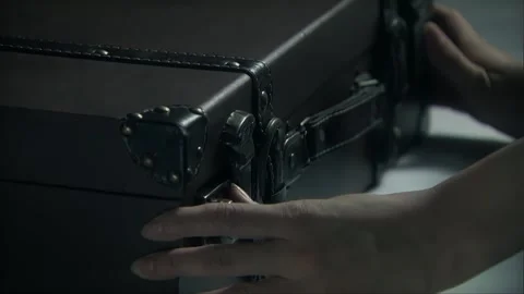 Opening black leather suitcase Stock Footage 302958824