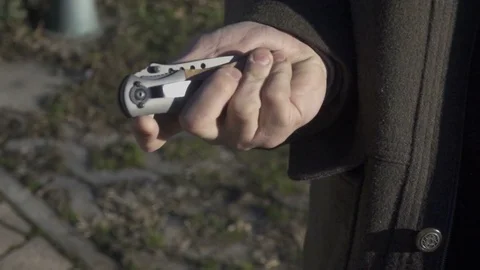 Opening Blade of Switchblade Automatic Knife, Slow Motion Stockbeeldmateriaal 71575823