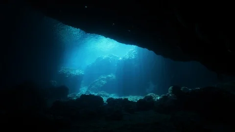 Opening on the blue sea seen from a crack between the rocks, Ustica, Med sea Stock Footage 125984247