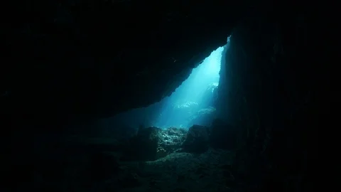 Opening onto the blue sea seen from inside the cave, Ustica, Mediterranean sea Stock Footage 125988269