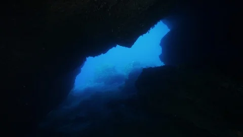 Opening onto the blue sea seen from inside the cave, Ustica, Mediterranean sea Stock Footage 126586332