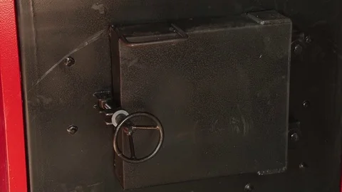 Opening the boiler with wood Stock Footage 70517502