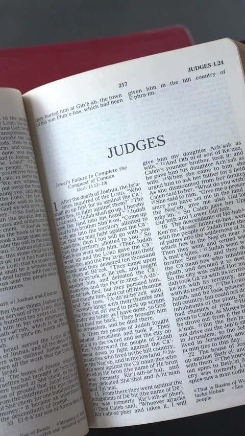 Opening to the Book of Judges of the Old Testament in the Holy Bible. Stock Footage 339042799
