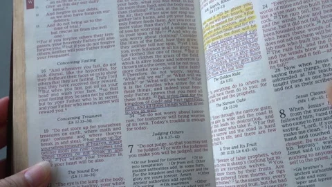 Opening the book of Matthew, chapter 6. New testament, Holy Bible. Video stock 334158648