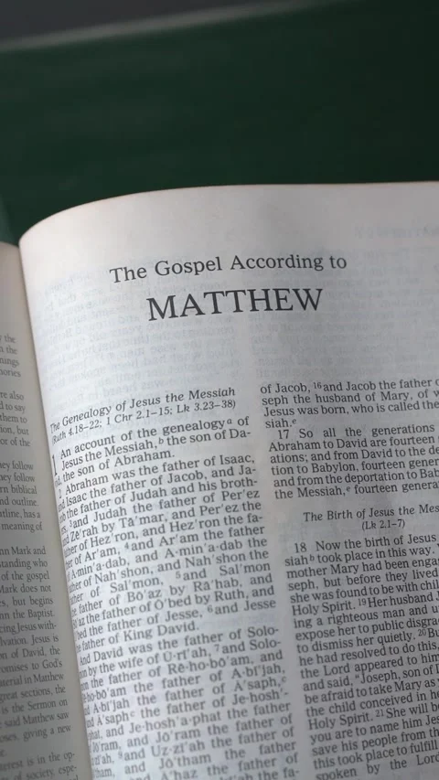 Opening to the book of Matthew of the New Testament in the Holy Bible 動画素材 341563459
