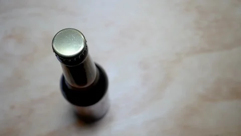 Opening a bottle of beer from which foam comes out. Stock Footage 127578105