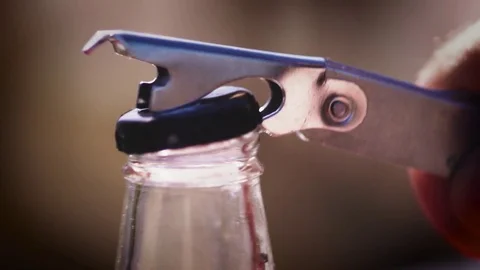 Opening a bottle cap in slow motion Stock Footage 77840691