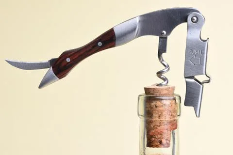 Opening bottle with corkscrew Stock Photos
