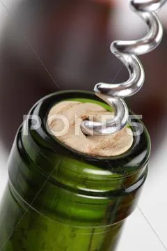 Opening a bottle with red wine Stock Photos