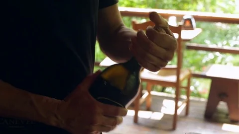 Opening a bottle of sparkling prosecco, in a restaurant in Conegliano Stock Footage