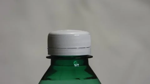 Opening a bottle on a white background. Stock Footage 255987754