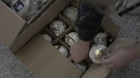 Opening a box with Christmas decorations Stock Footage 237342976