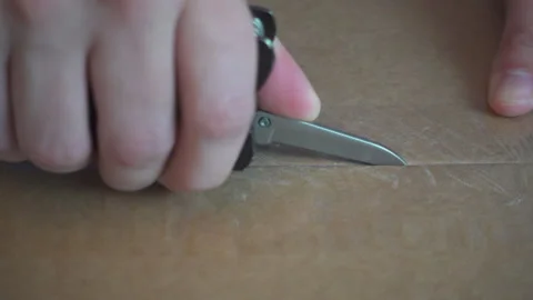 Opening Box with MultiTool Stock Footage 328963750