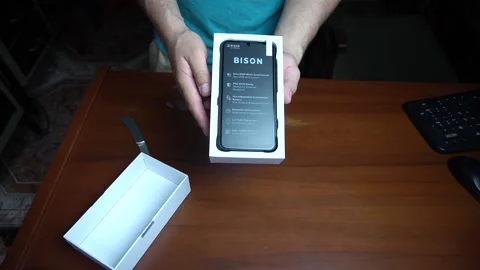 Opening the box of a Umidig Bison cell phone - Lima, Peru - January 2021 Stock Footage 147470131