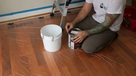 Opening a Bucket of Paint Stock Footage 247508930