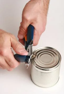 Opening a can with opening can Stock Photos