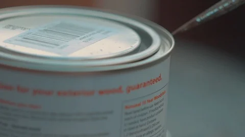 Opening a can of paint Stock Footage 94636940
