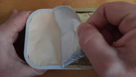 Opening a can of processed cheese Stock Footage 144472902