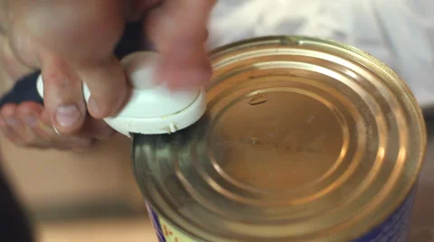 Opening a can of tomato sauce Stock Footage 36151240