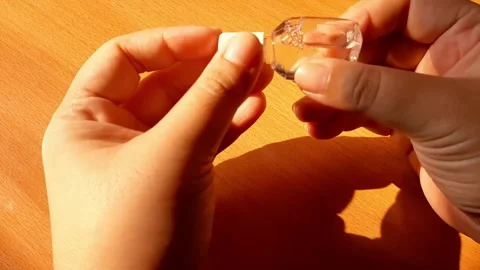 Opening the cap of an eye drop bottle Stock Footage 284441638