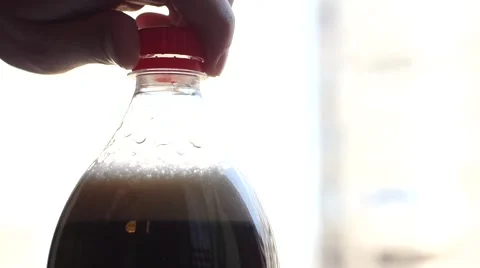 Opening carbonated beverage bottles with splashes Stock Footage 49000327