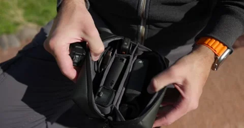 Opening case of modern compact DJI Osmo Pocket 3 stabilized handheld Video stock 255630082