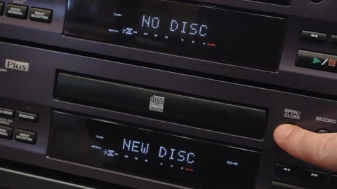 Opening a cd tray and taking out a blank white disk Stock Footage 108543357