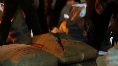 Opening the cement bag with knife Stock Footage 80085699