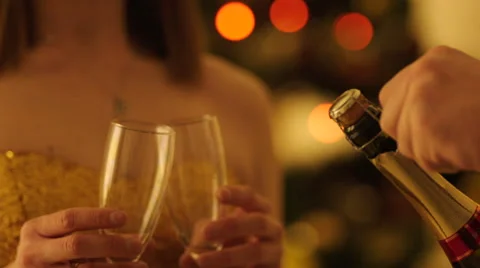 Opening Champagne Bottle before Christmas Stock Footage 57749042