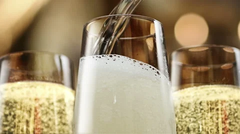 Opening a champagne. New Year's party pouring champagne Stock Footage