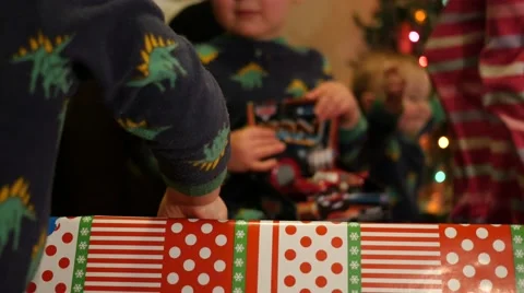 Opening Christmas presents close Stock Footage 57638866