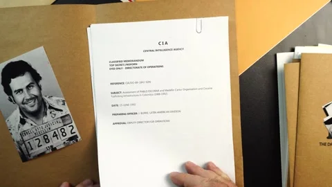 Opening CIA Case File Folder With Pablo Escobar Photo and Confidential Stock Footage 324490578
