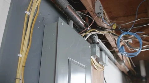 Opening Circuit Breaker Box in Basement TILT DOWN Stock-Footage 104874832