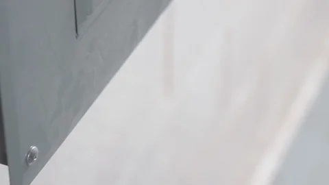 Opening Circuit Breaker Box in Basement CLOSE UP TILT UP Stock-Footage 104875192