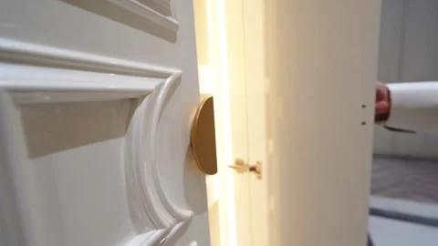 Opening a Closet Door to Soft Light 스톡 동영상 307398981