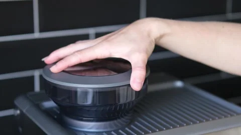 Opening the coffee grinder lid Stock Footage 201600029