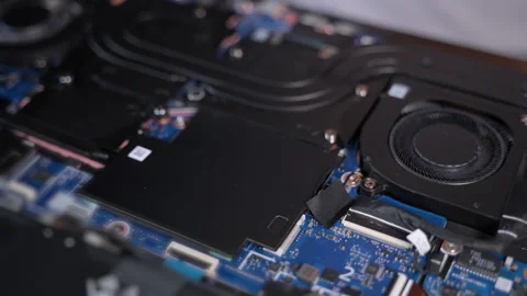 Opening the computer back cover and showing close-up view of a laptop internal Stock Footage 326085548