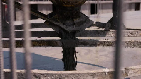 Opening construction bucket to discharge fresh concrete close up Stock Footage 341986787